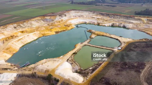 Mine water storage from the air. Using geochemical data from static and kinetic column tests, we predict metal leaching and acid rock drainage from pits, waste dumps, tailings storage facilities and ore stockpiles into the receiving environment.